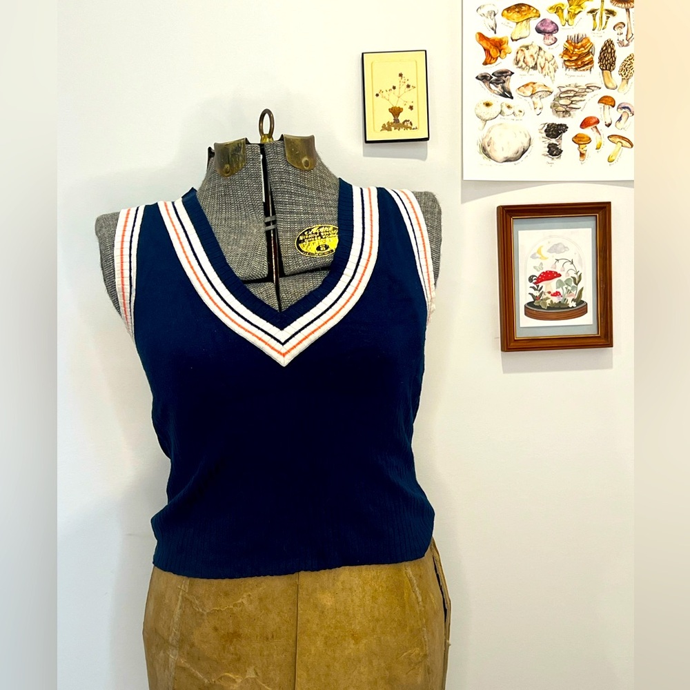 White colored navy blur sweater vest